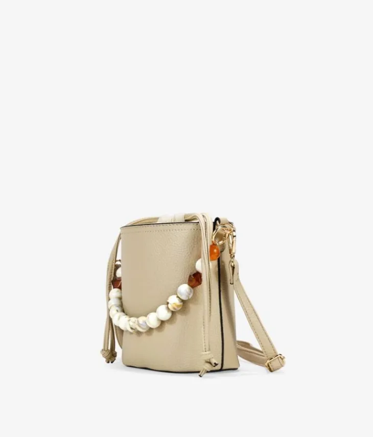 New Bosanova Bolso bandolera beige con asa de piedras